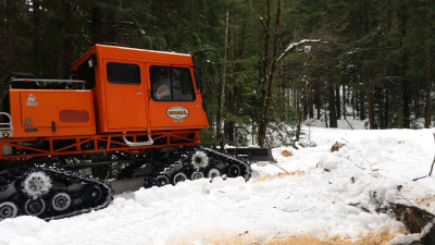 The sno-cat on the 1506 Road, at the bottom of the hill, close to the 1507 junction.
